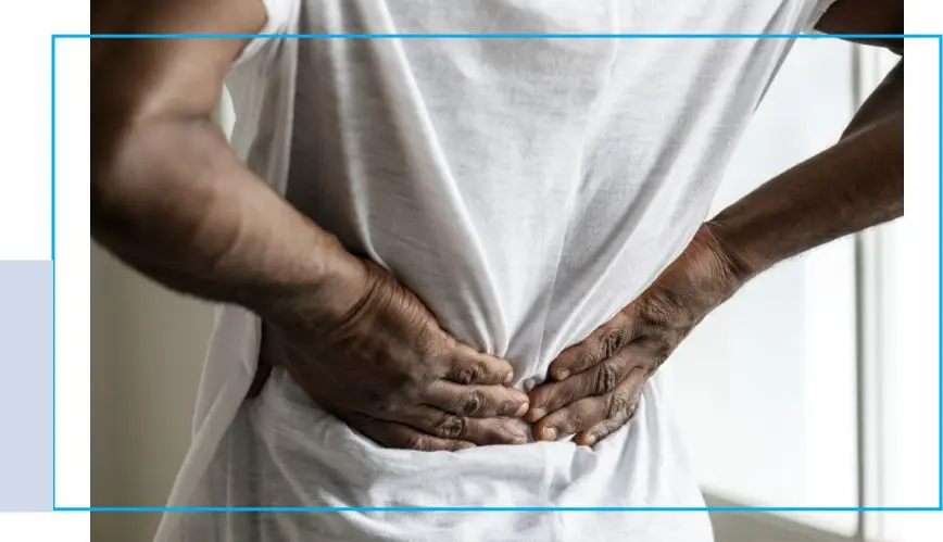 A person with their hands on the back of his body.