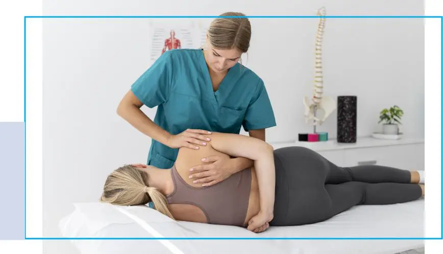 A woman is getting her back examined by a chiropractor.