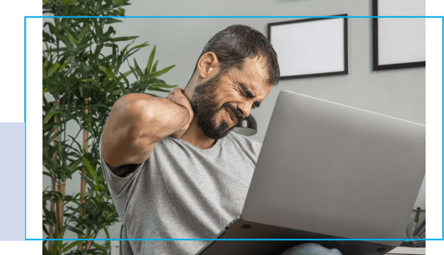 A man sitting in front of a laptop computer.