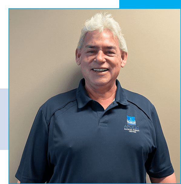 A man with white hair and glasses wearing a blue shirt.